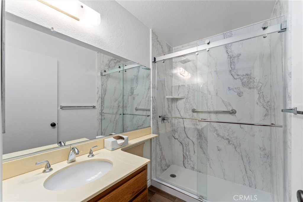 1159 Stone Pine Lane, Unit C Corona, CA 92879 - Photo 12 of 25 a bathroom with a sink and a mirror