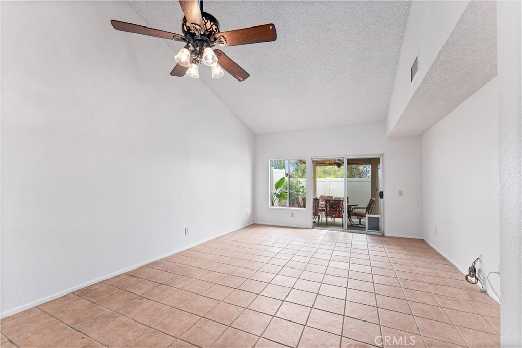 1159 Stone Pine Lane, Unit C Corona, CA 92879 - Photo 4 of 25 wooden floor in an empty room with a window