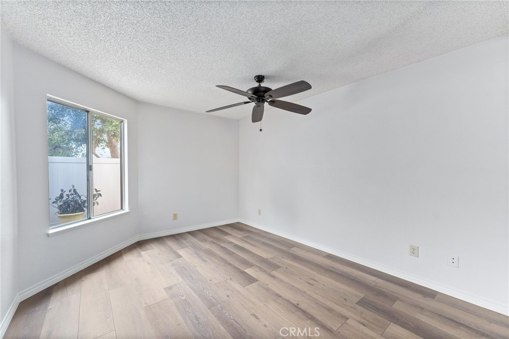1159 Stone Pine Lane, Unit C Corona, CA 92879 - Photo 8 of 25 an empty room with window and windows