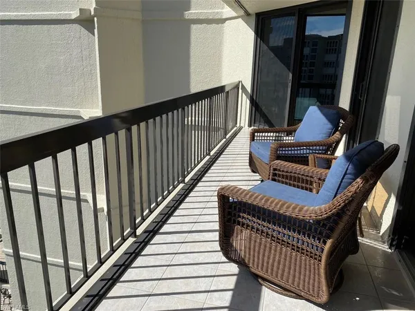a view of a livingroom with furniture and a window