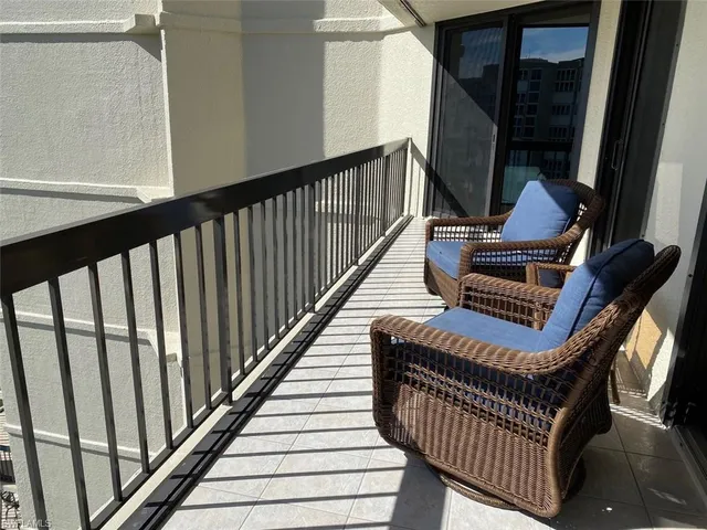 a view of a livingroom with furniture and a window