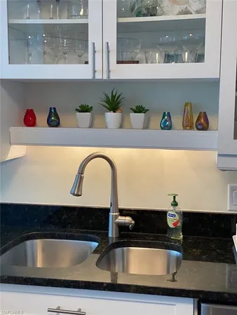 a bedroom with a bed next to a large window