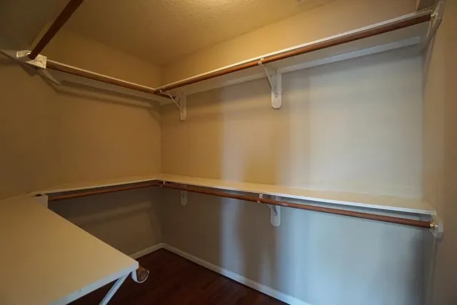 a view of a room with shelf on the wall