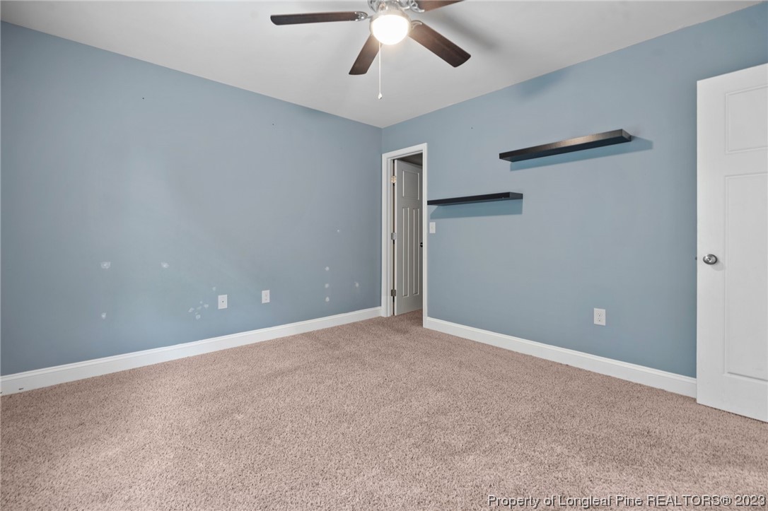 376 Tactical Drive Bunnlevel, NC 28323 - Photo 25 of 46 a view of an empty room with a ceiling fan