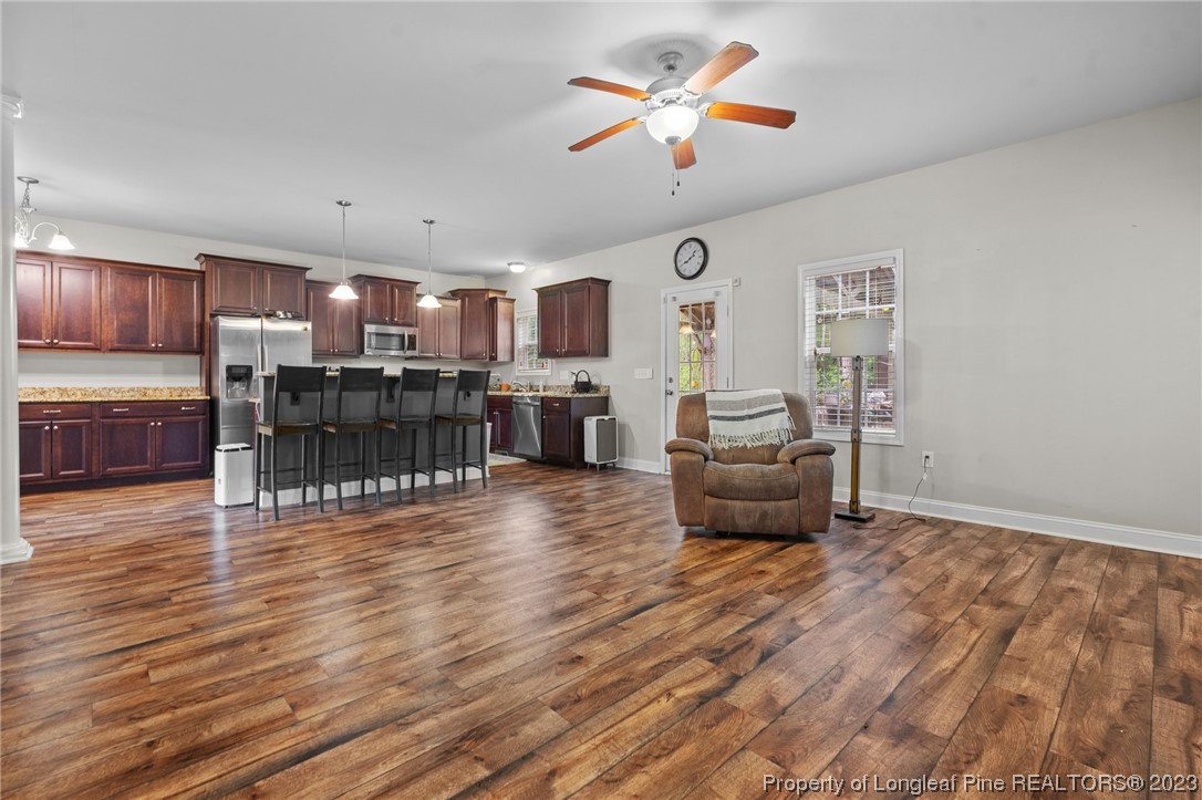 376 Tactical Drive Bunnlevel, NC 28323 - Photo 29 of 46 a living room with furniture and kitchen view