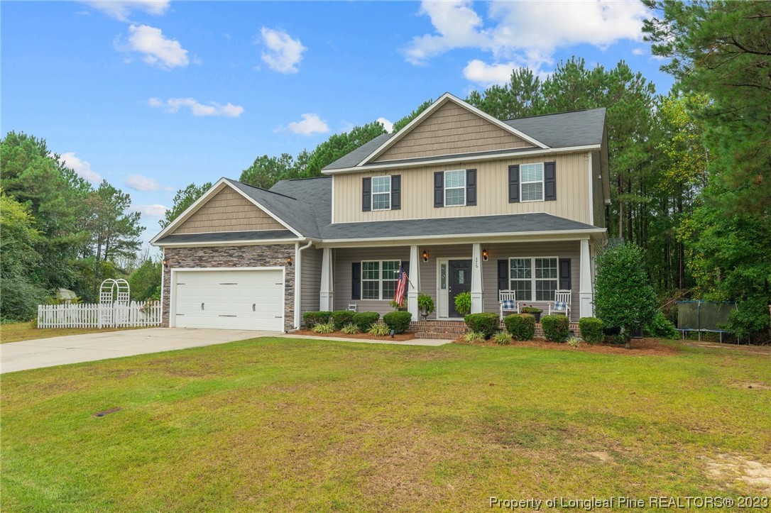 376 Tactical Drive Bunnlevel, NC 28323 - Photo 34 of 46 a front view of a house with garden
