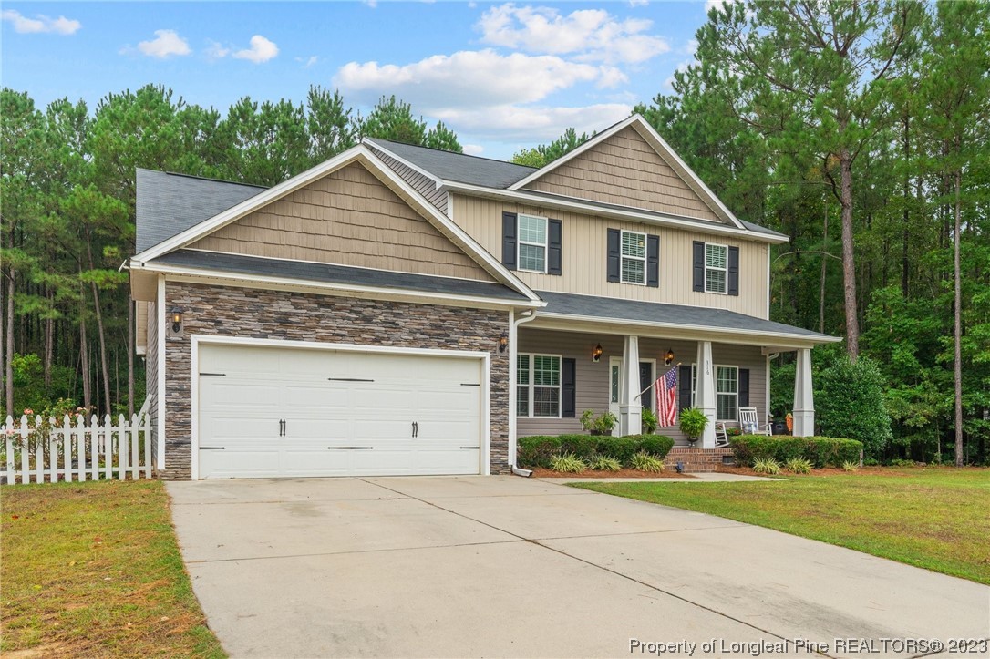 376 Tactical Drive Bunnlevel, NC 28323 - Photo 37 of 46 front view of house with a yard