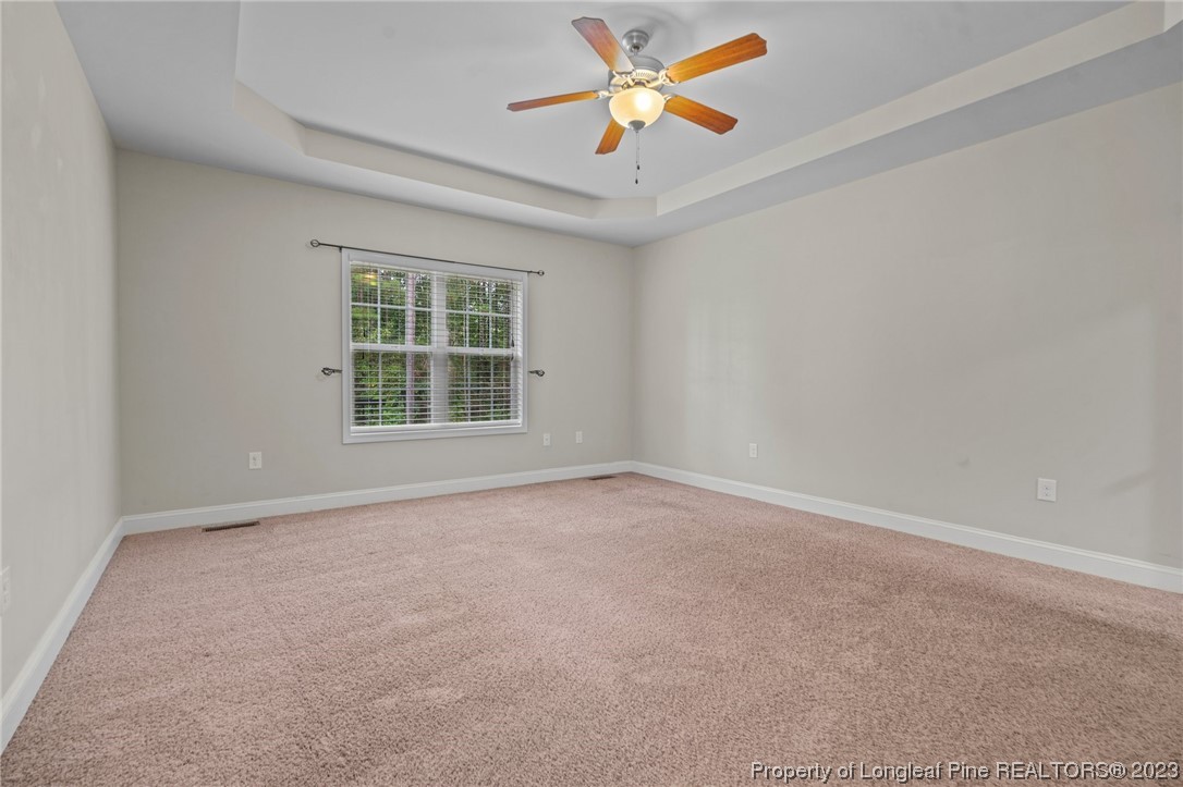 376 Tactical Drive Bunnlevel, NC 28323 - Photo 39 of 46 an empty room with a window and a fan