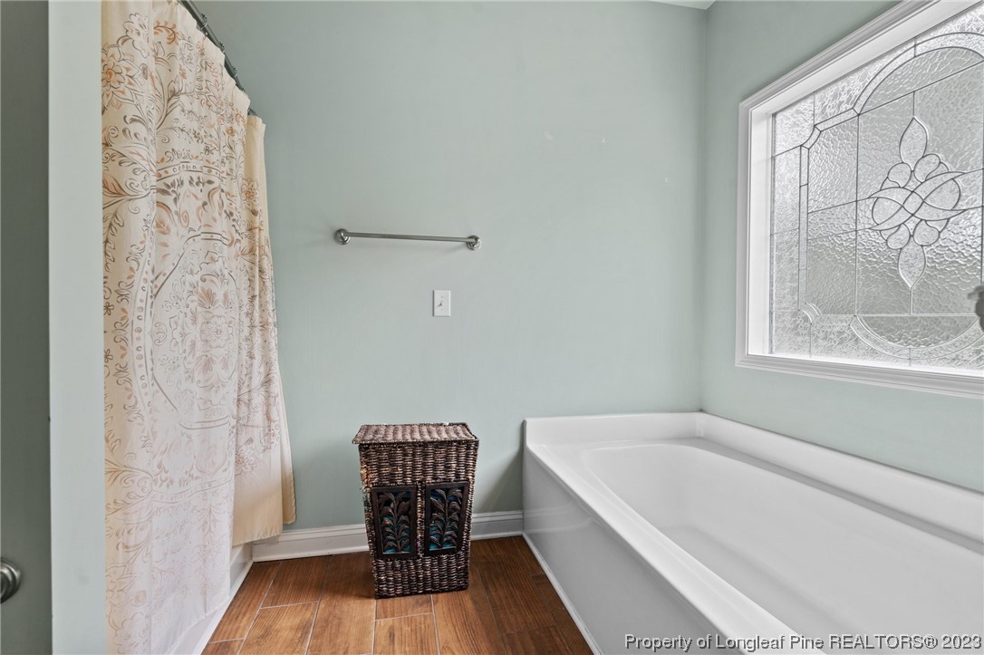 376 Tactical Drive Bunnlevel, NC 28323 - Photo 41 of 46 a bathroom with a bathtub and shower