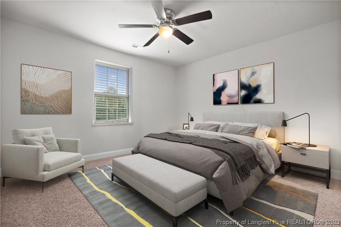 376 Tactical Drive Bunnlevel, NC 28323 - Photo 43 of 46 a bedroom with a bed and a couch