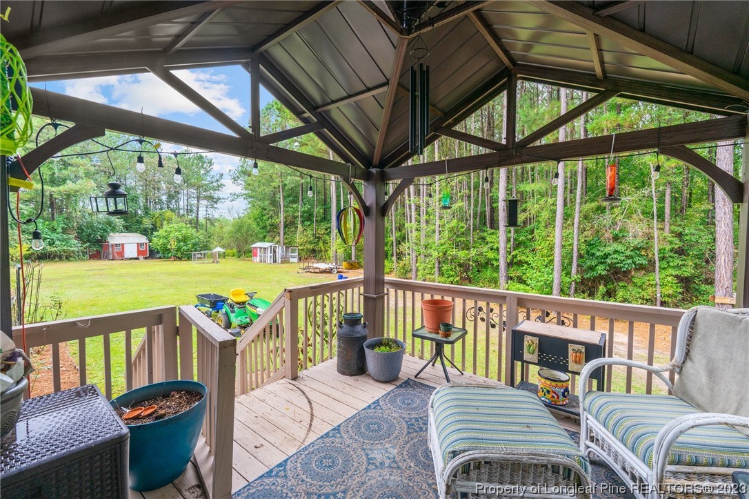 376 Tactical Drive Bunnlevel, NC 28323 - Photo 44 of 46 a view of a patio with a table chairs and a couches