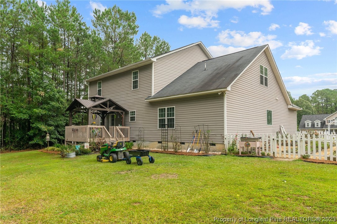 376 Tactical Drive Bunnlevel, NC 28323 - Photo 5 of 46 a view of a house with backyard and sitting area