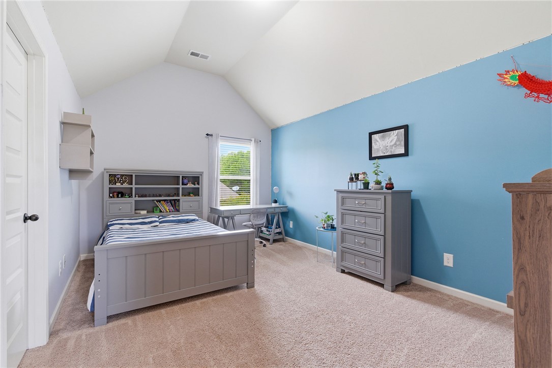 138 Buckland Drive Anderson, SC 29621 - Photo 30 of 49 This spacious bedroom features a vaulted ceiling and ample natural light, perfect for relaxation or study.