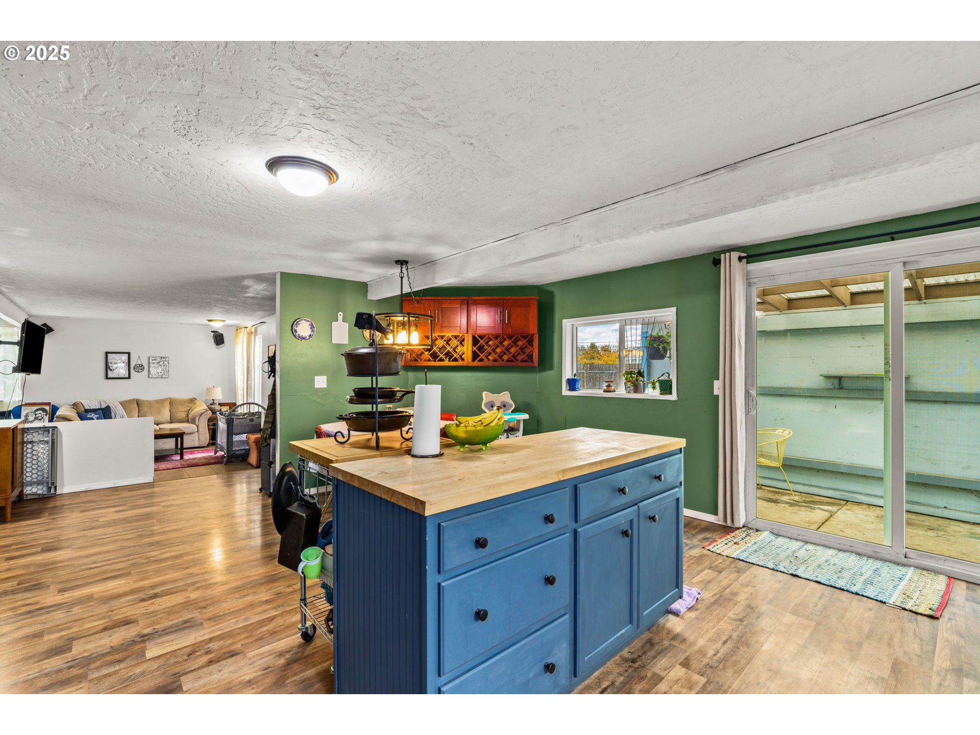 5736 A Street Springfield, OR 97478 - Photo 11 of 26 a kitchen with a stove and a wooden floor