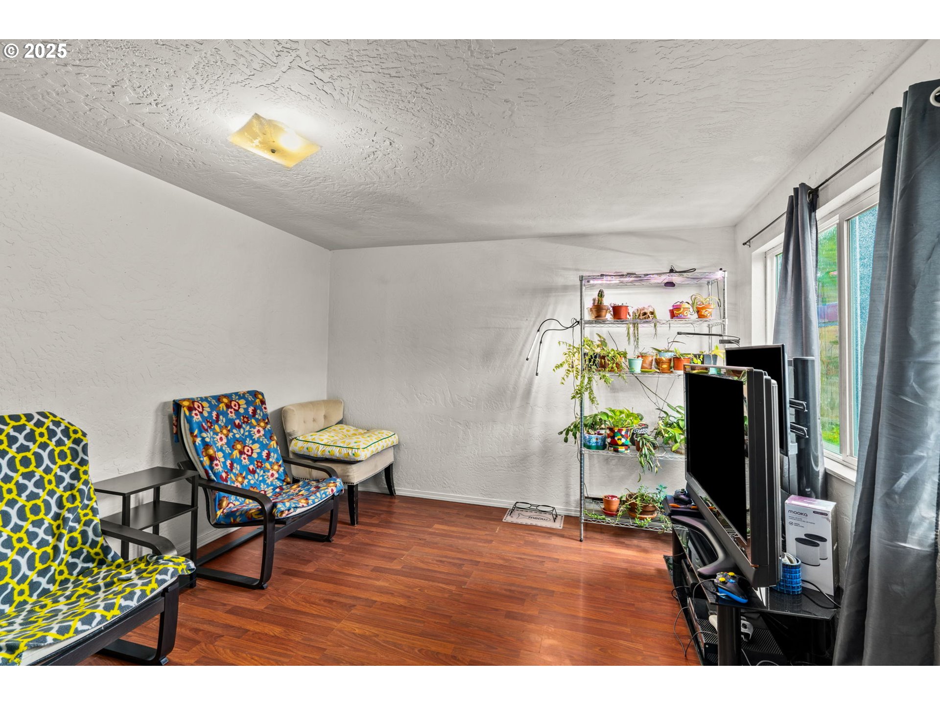 5736 A Street Springfield, OR 97478 - Photo 7 of 26 a living room with furniture and a flat screen tv