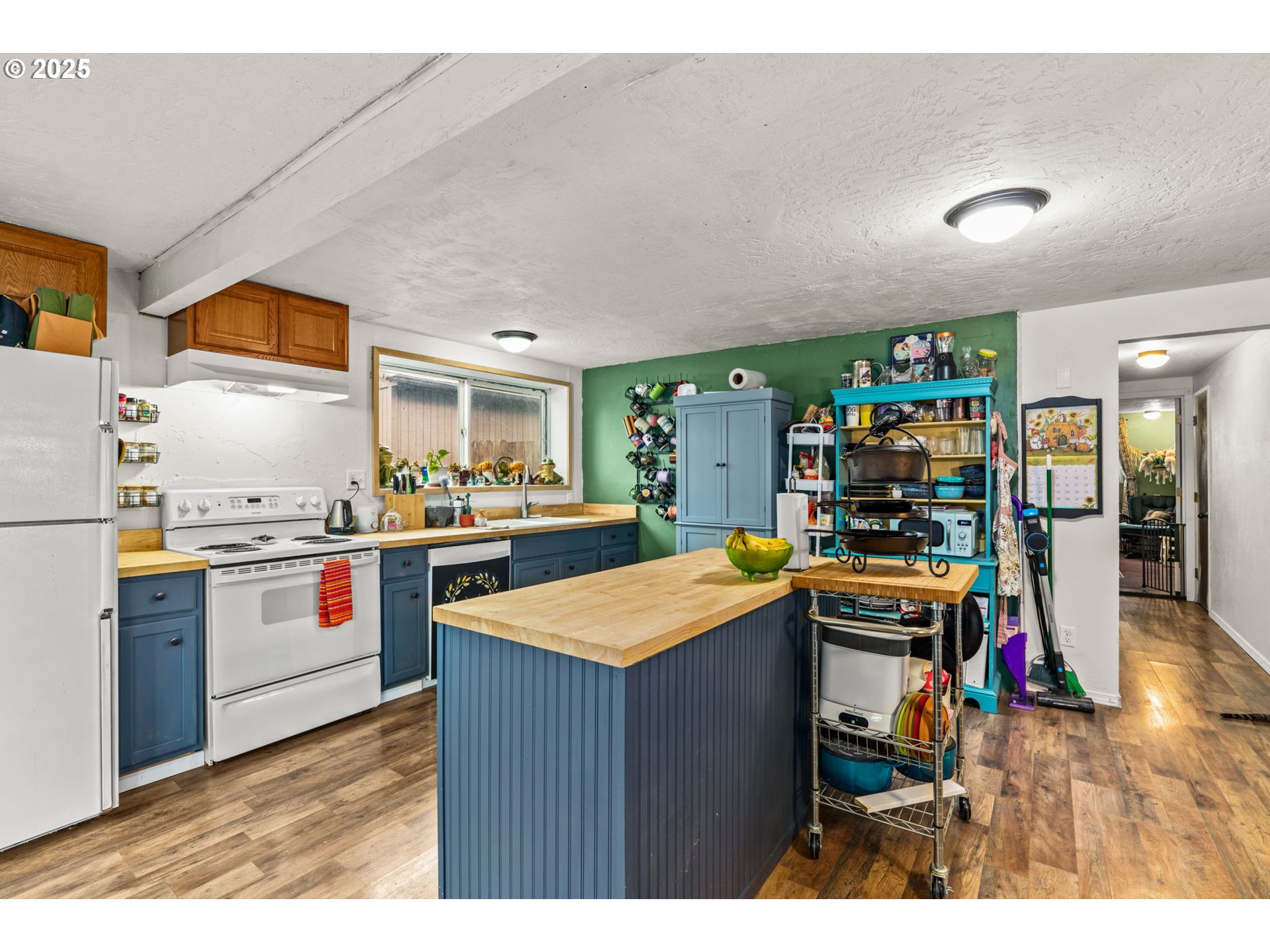 5736 A Street Springfield, OR 97478 - Photo 9 of 26 a kitchen with stainless steel appliances granite countertop a stove and a refrigerator