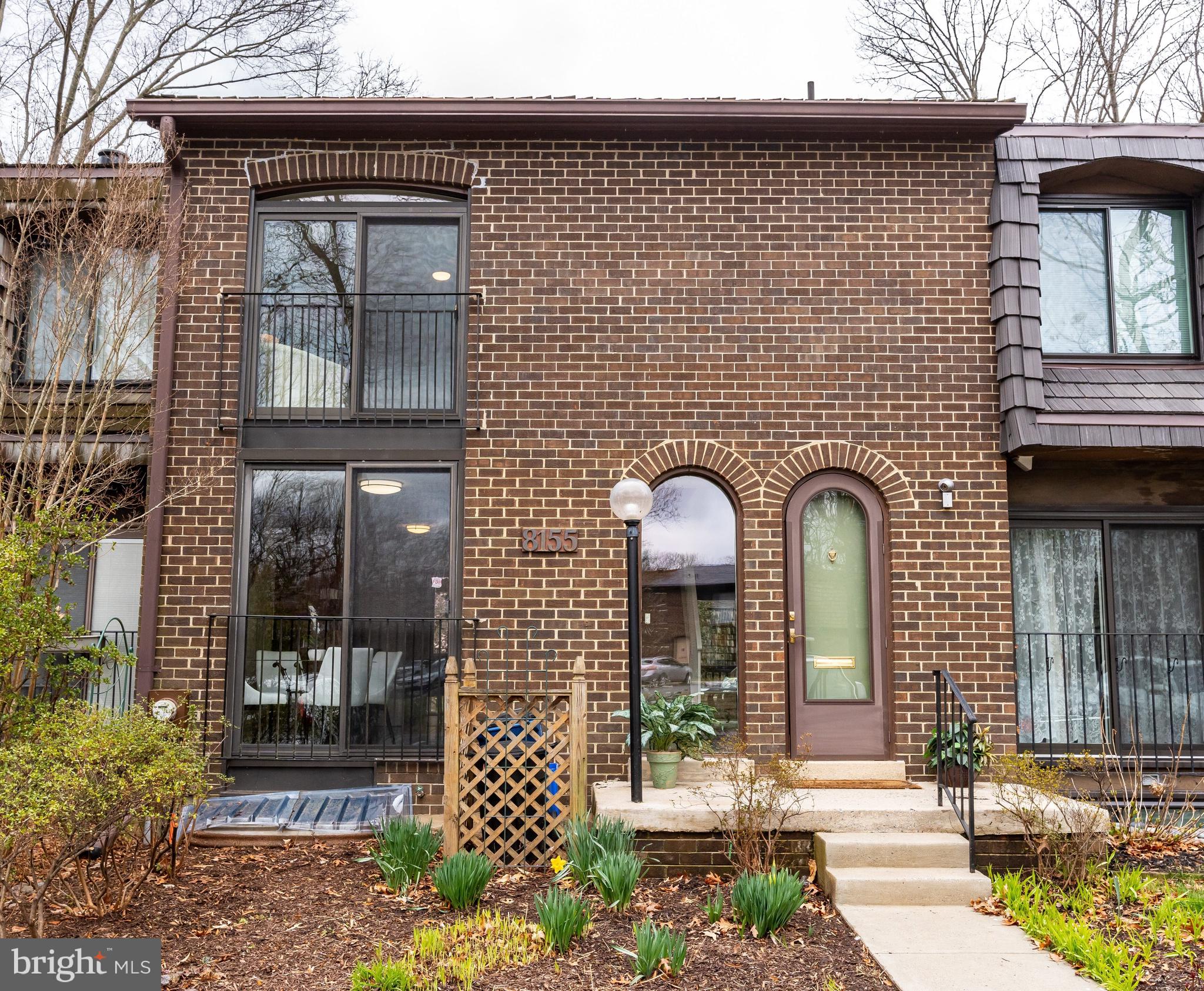 8155 Inverness Ridge Road Potomac, MD 20854 - Photo 1 of 22 Brick Exterior with Stacked Glass Sliding Doors
