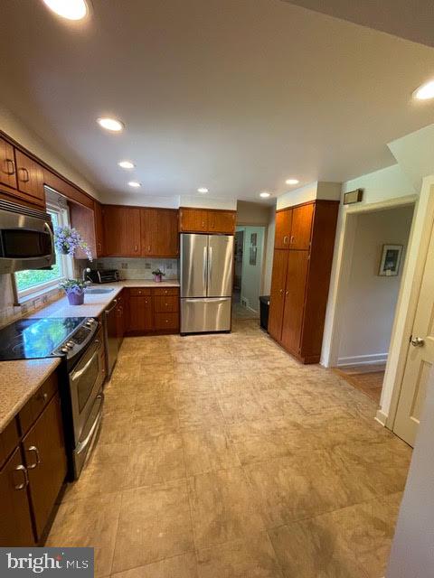 kitchen with stainless appliances and pantry