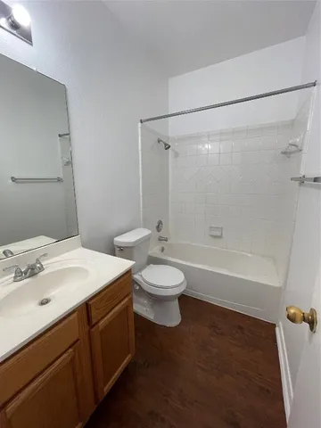 a bathroom with a sink a toilet and a bathtub