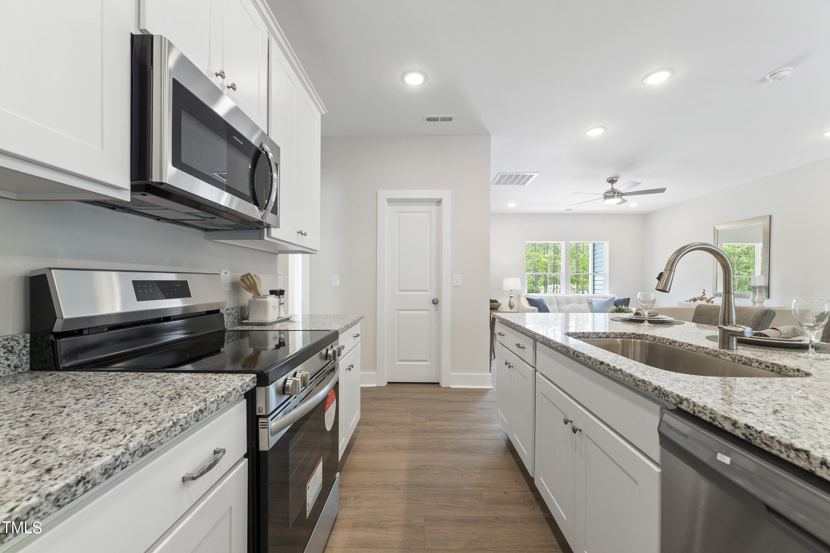 25 Chester Lane Middlesex, NC 27557 - Photo 12 of 32 a kitchen with a sink stove and microwave