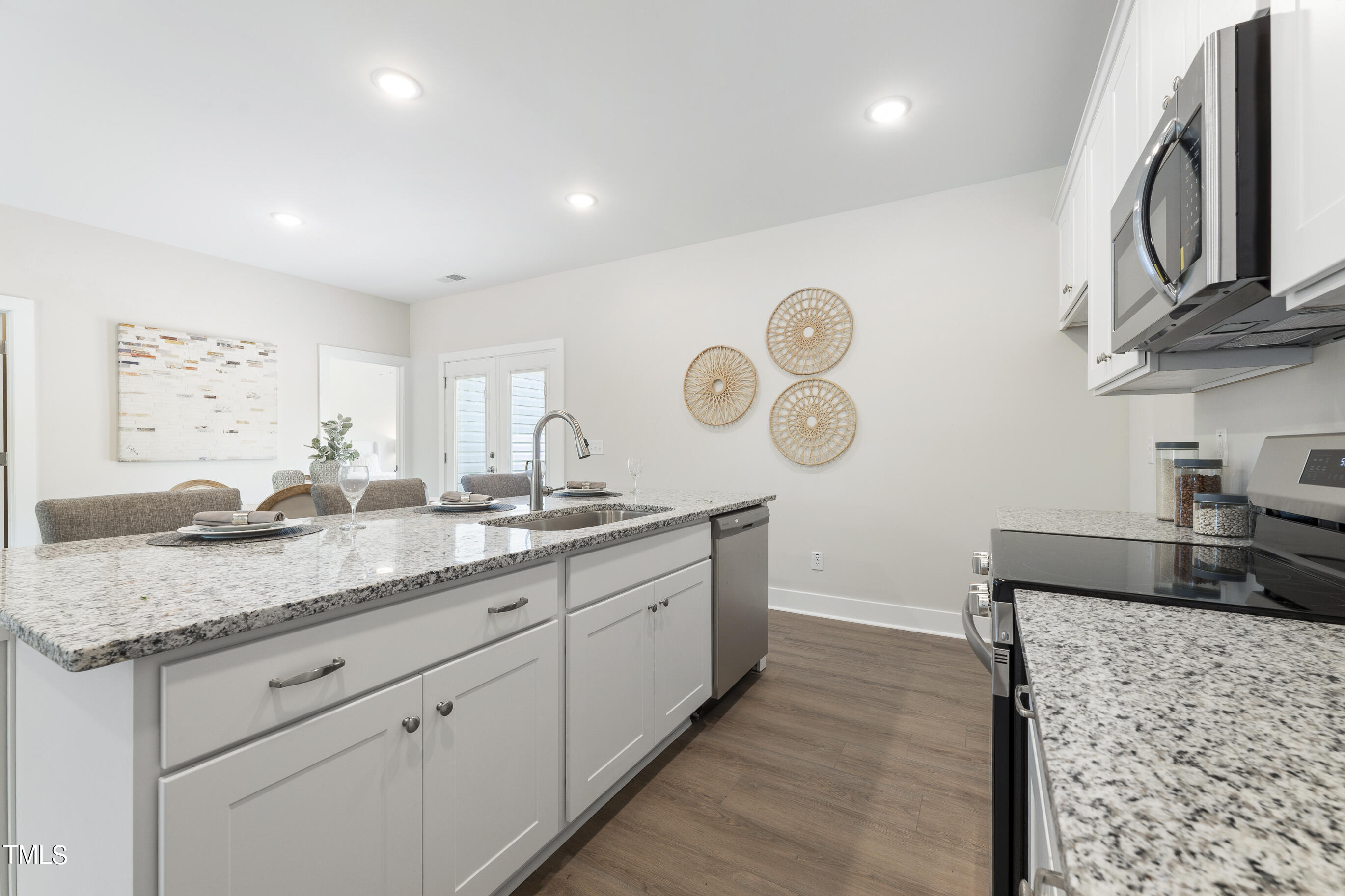 25 Chester Lane Middlesex, NC 27557 - Photo 13 of 32 a kitchen with stainless steel appliances granite countertop a sink and a stove