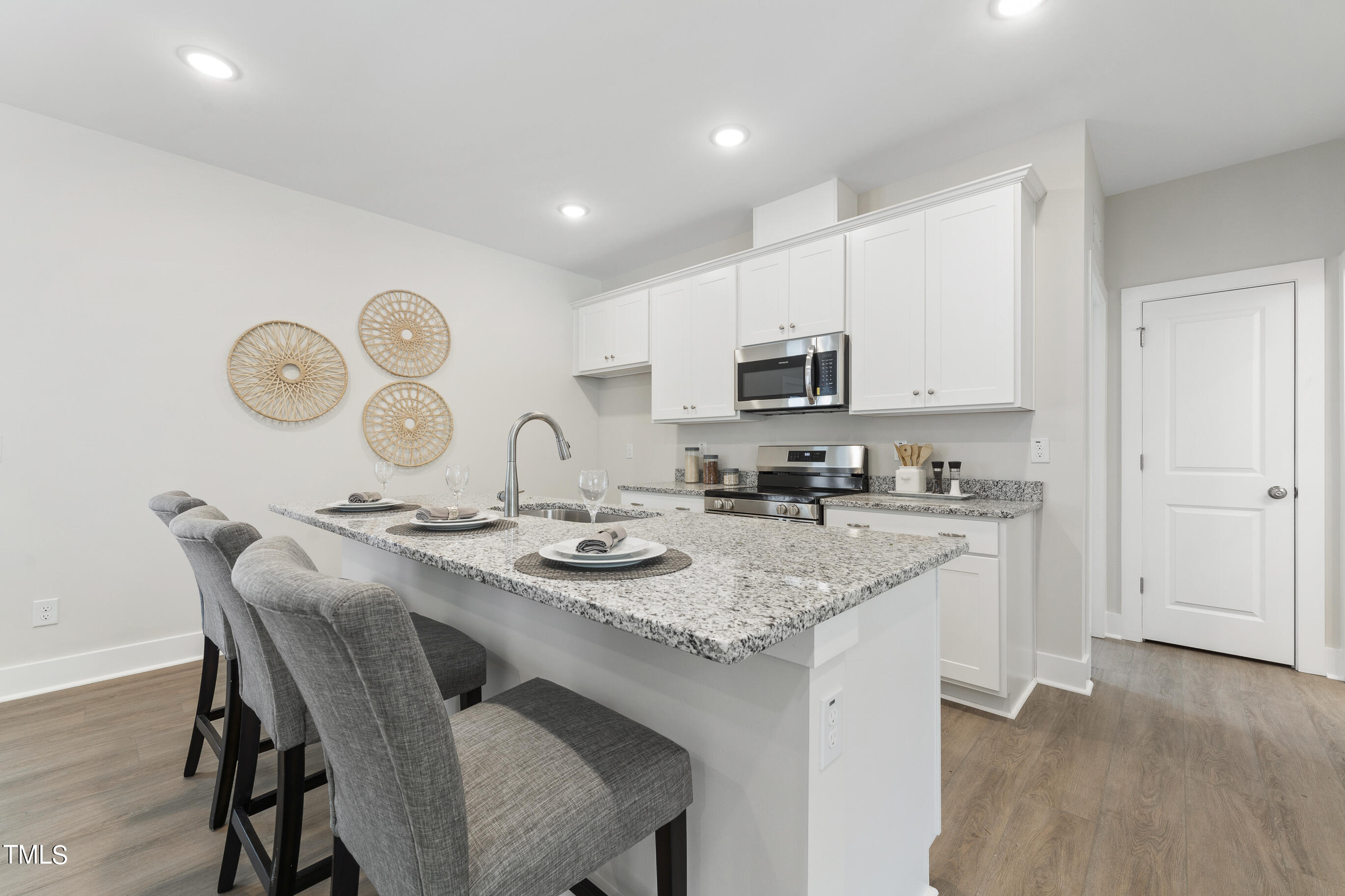 25 Chester Lane Middlesex, NC 27557 - Photo 14 of 32 a kitchen with a sink a stove a microwave and cabinets