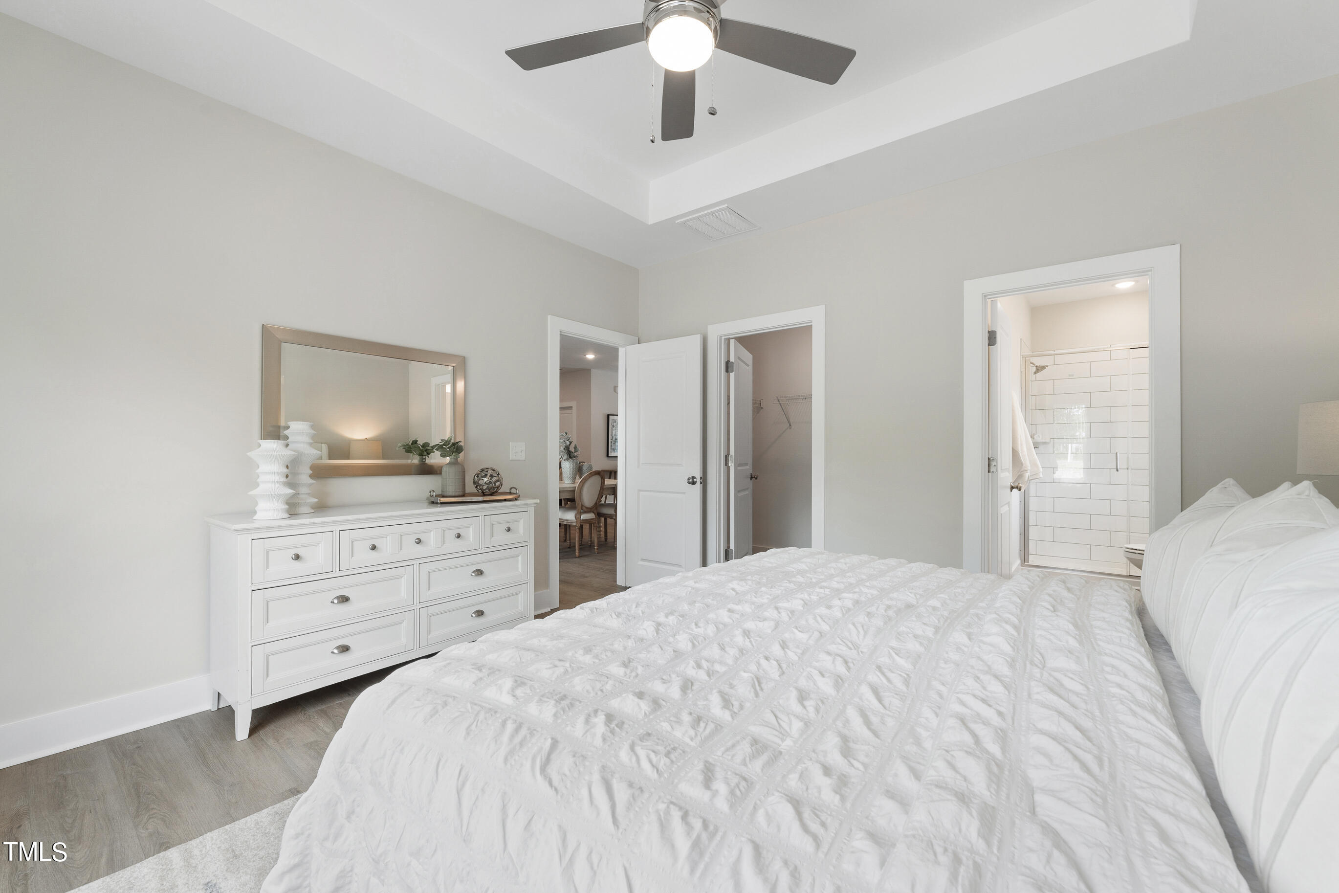 25 Chester Lane Middlesex, NC 27557 - Photo 16 of 32 a bedroom with a large bed and a chandelier