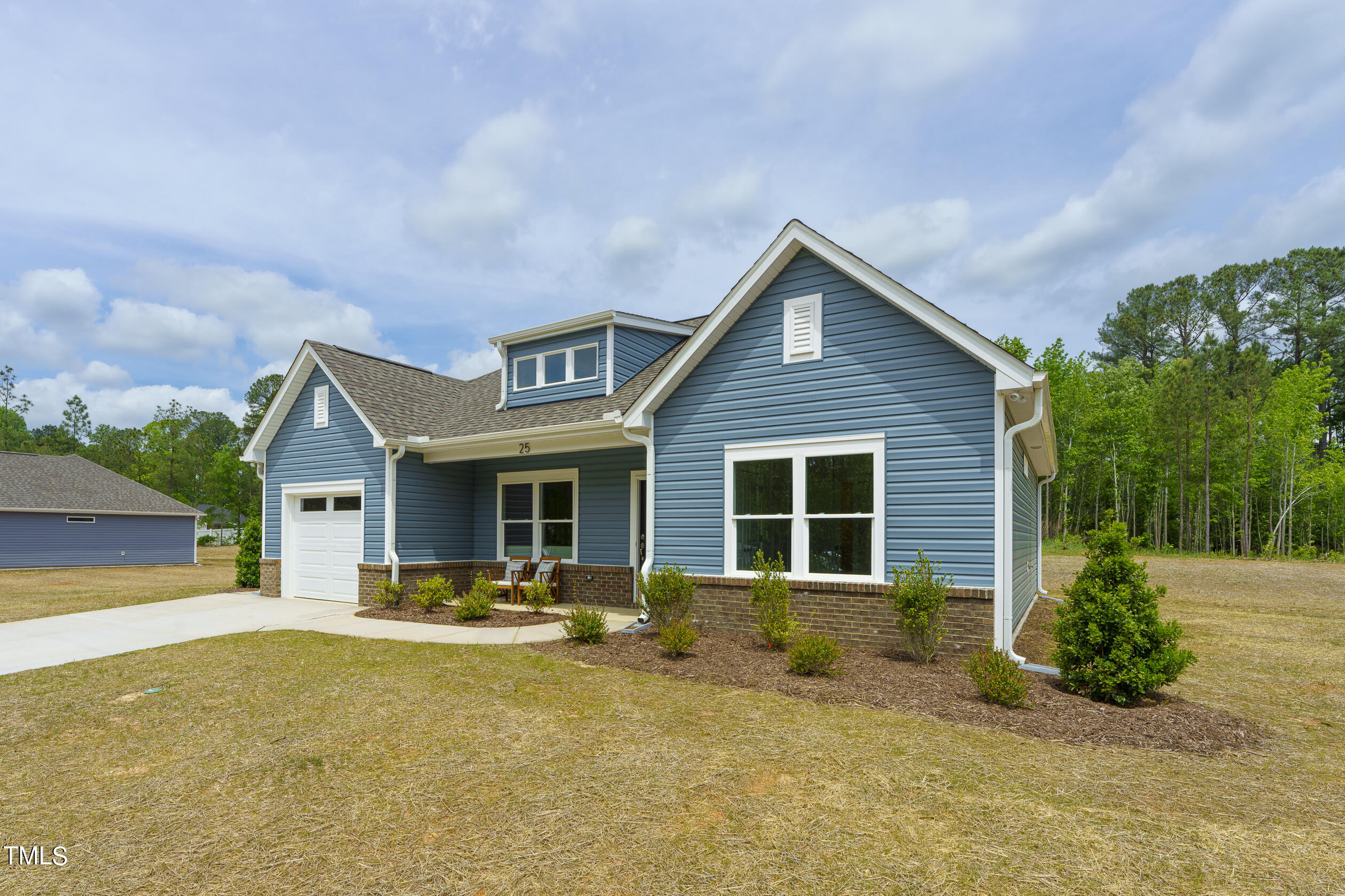 25 Chester Lane Middlesex, NC 27557 - Photo 2 of 32 a front view of house with yard and green space