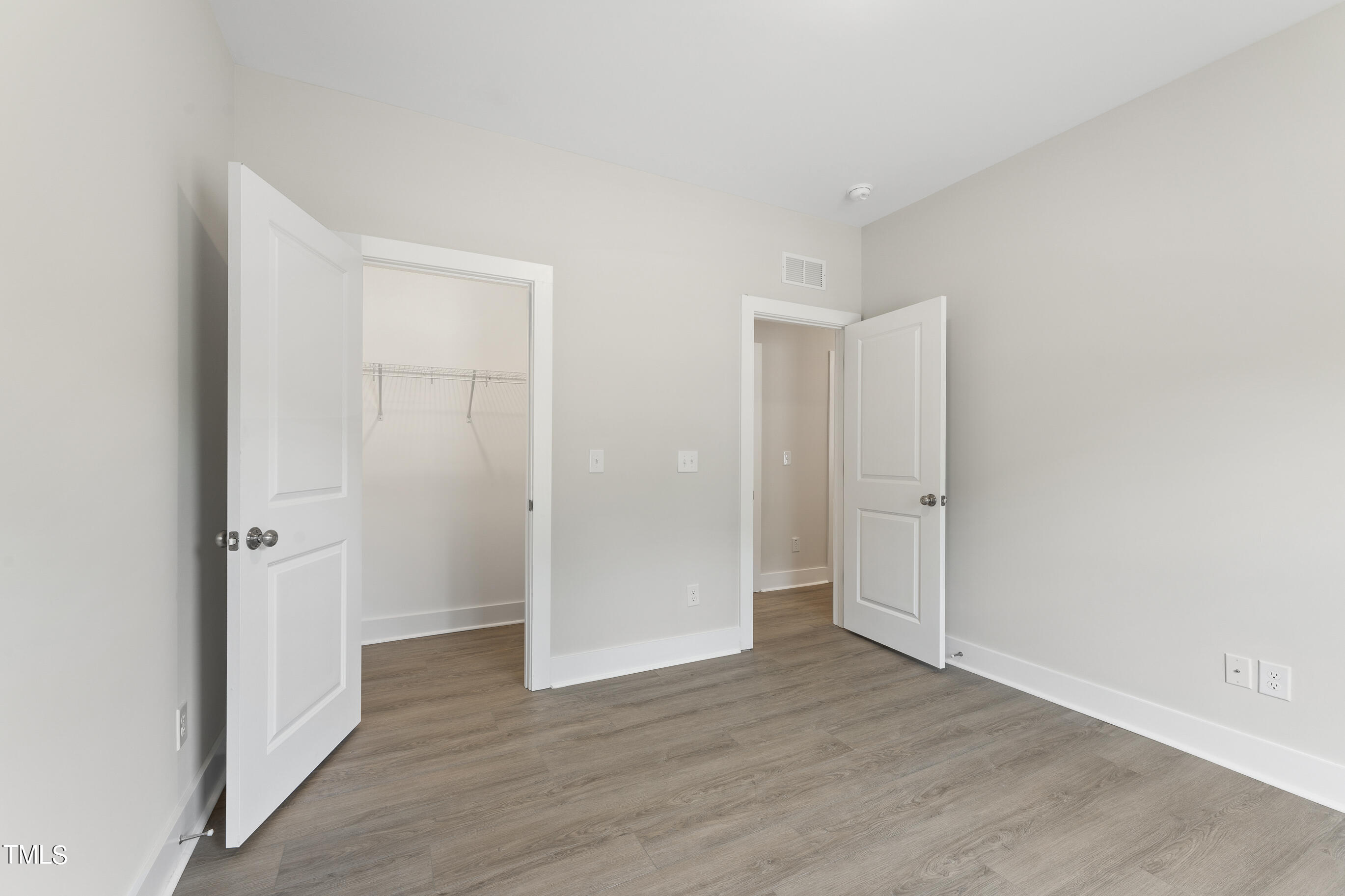 25 Chester Lane Middlesex, NC 27557 - Photo 21 of 32 a view of a hallway with wooden floor