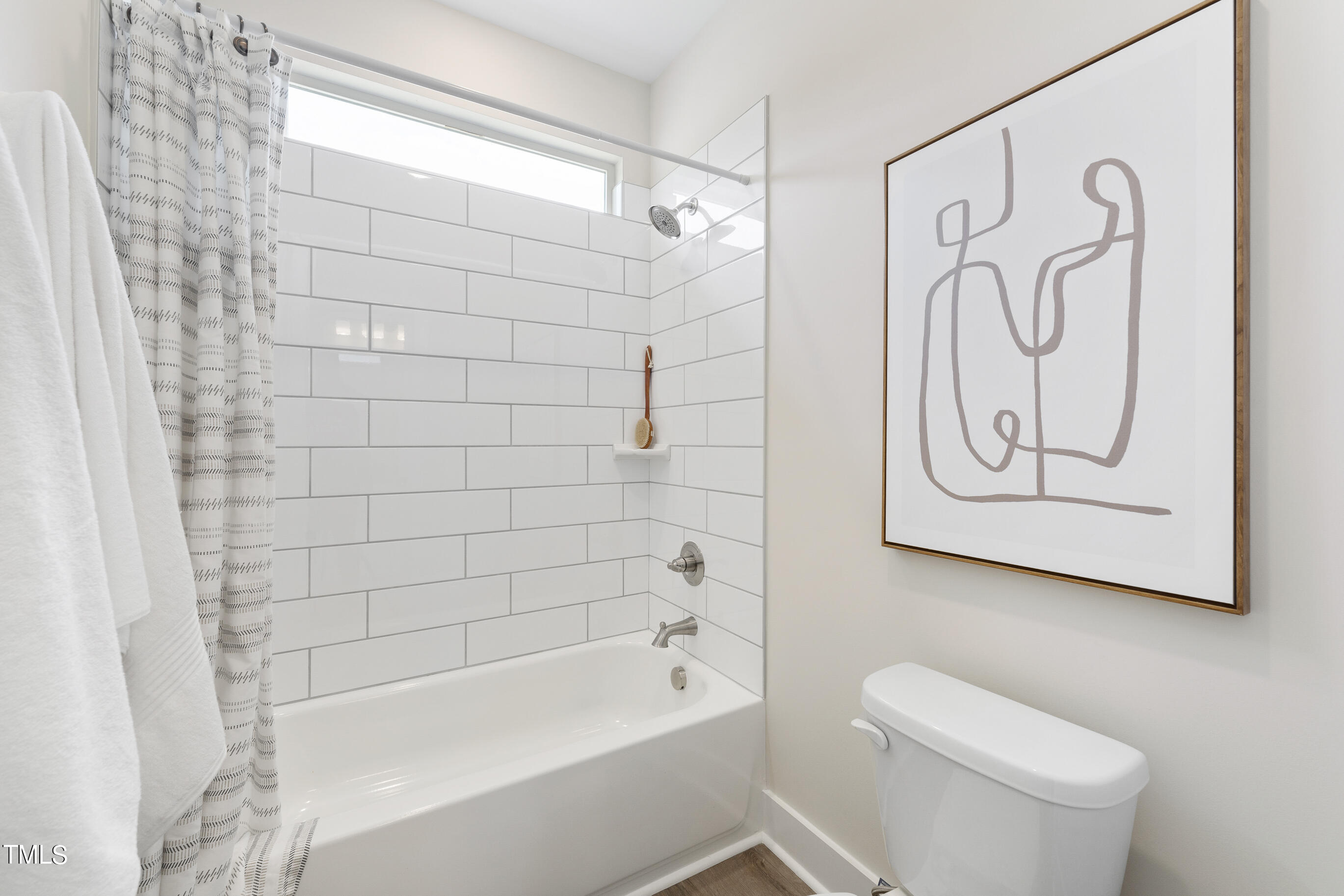 25 Chester Lane Middlesex, NC 27557 - Photo 23 of 32 a bathroom with a toilet and a bathtub