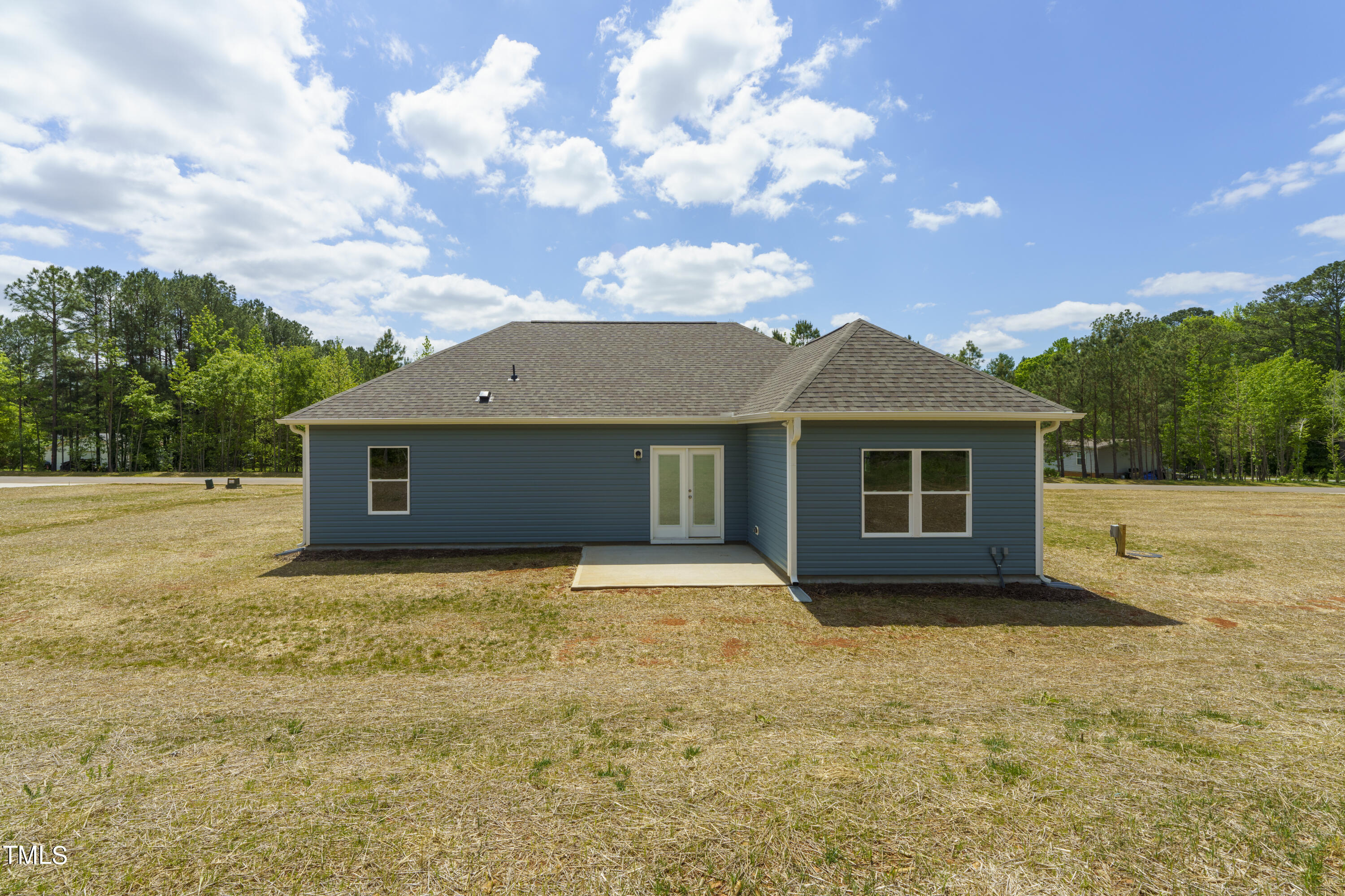 25 Chester Lane Middlesex, NC 27557 - Photo 30 of 32 a house with trees in front of it