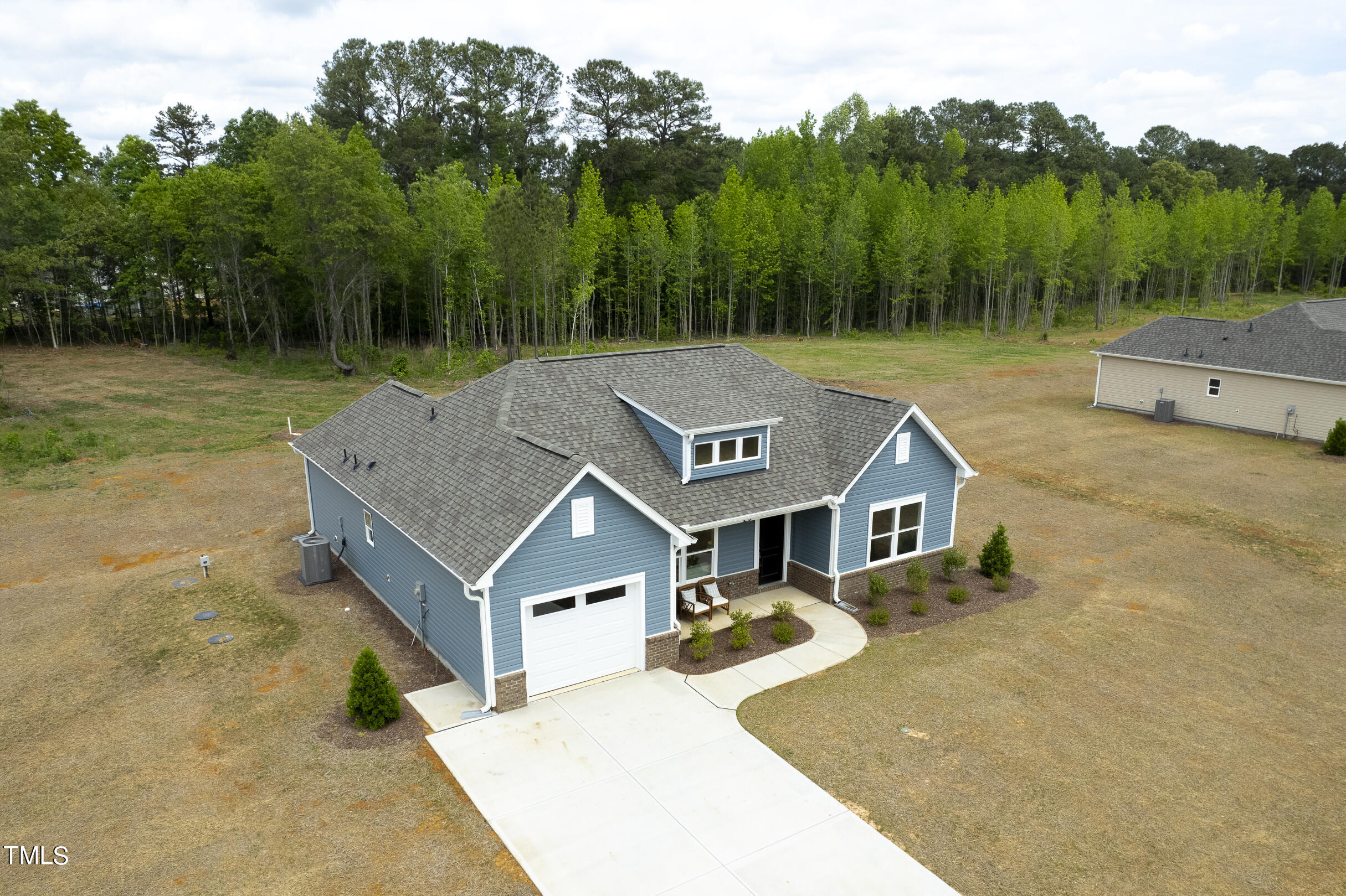 25 Chester Lane Middlesex, NC 27557 - Photo 3 of 32 an aerial view of a house with swimming pool and next to a yard
