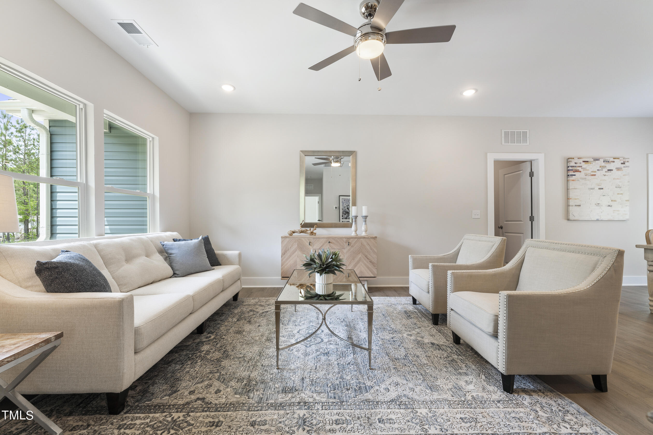 25 Chester Lane Middlesex, NC 27557 - Photo 7 of 32 a living room with furniture and a large window