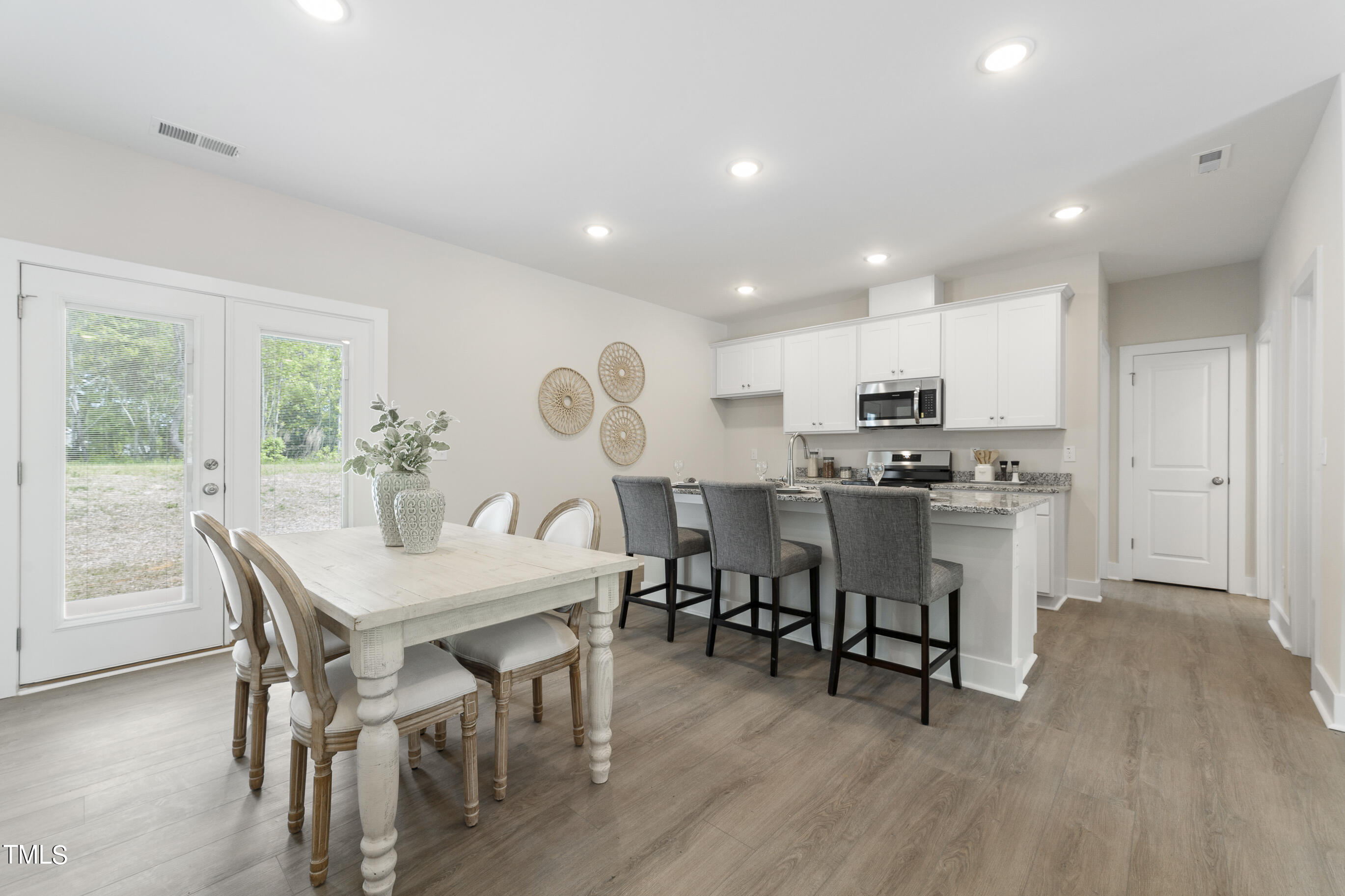 25 Chester Lane Middlesex, NC 27557 - Photo 8 of 32 a view of kitchen with refrigerator dining table and chairs