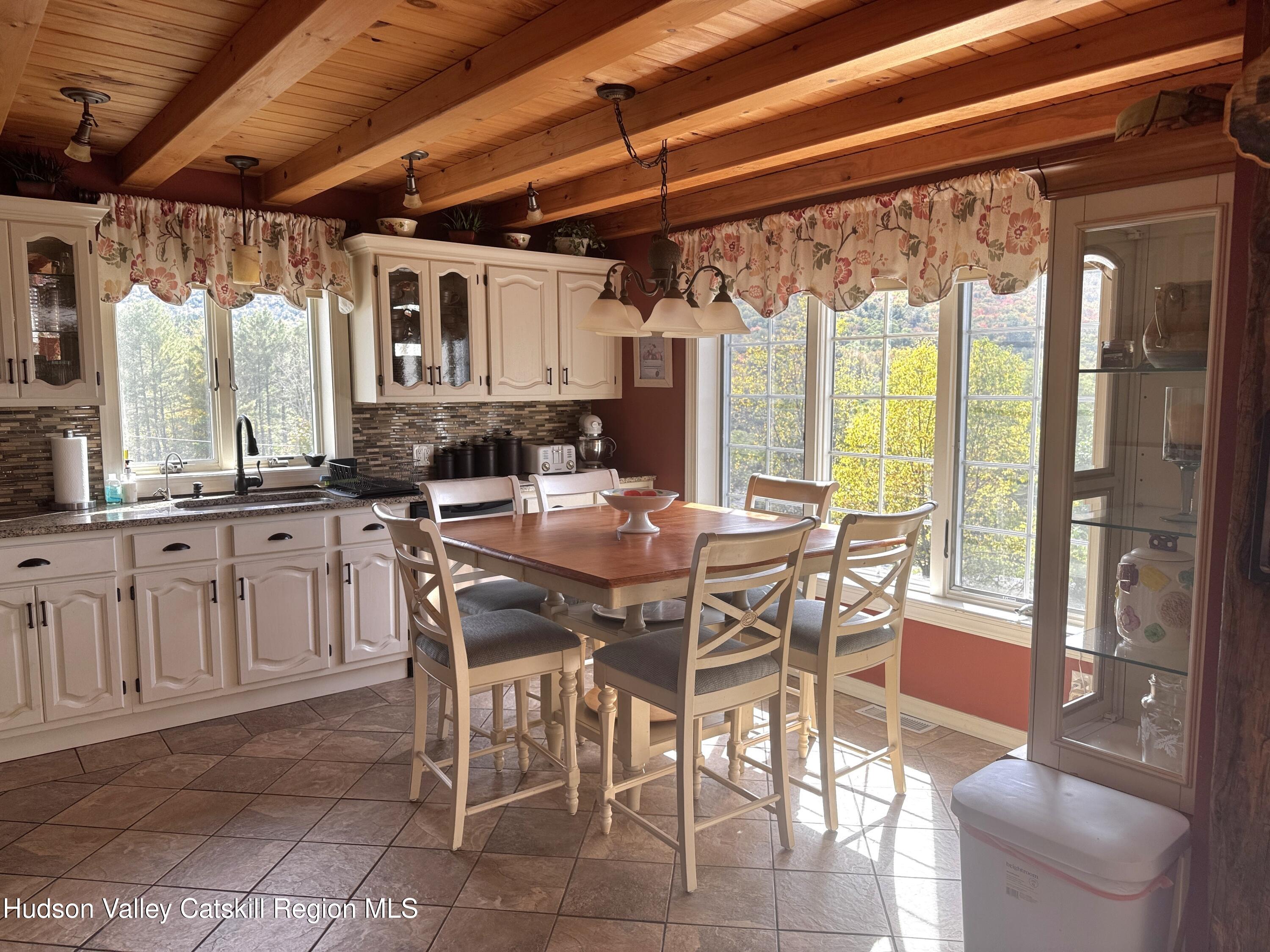 19 Pond View Road Ashland, NY 12468 - Photo 15 of 37 a dining table with chairs and window