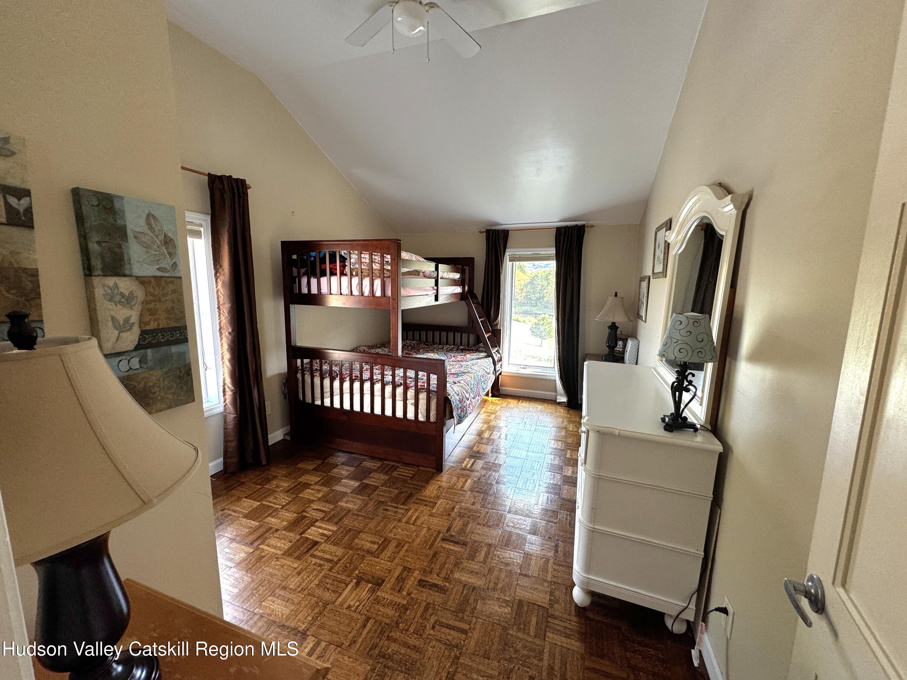 19 Pond View Road Ashland, NY 12468 - Photo 17 of 37 a view of a livingroom with furniture and a floor to ceiling window