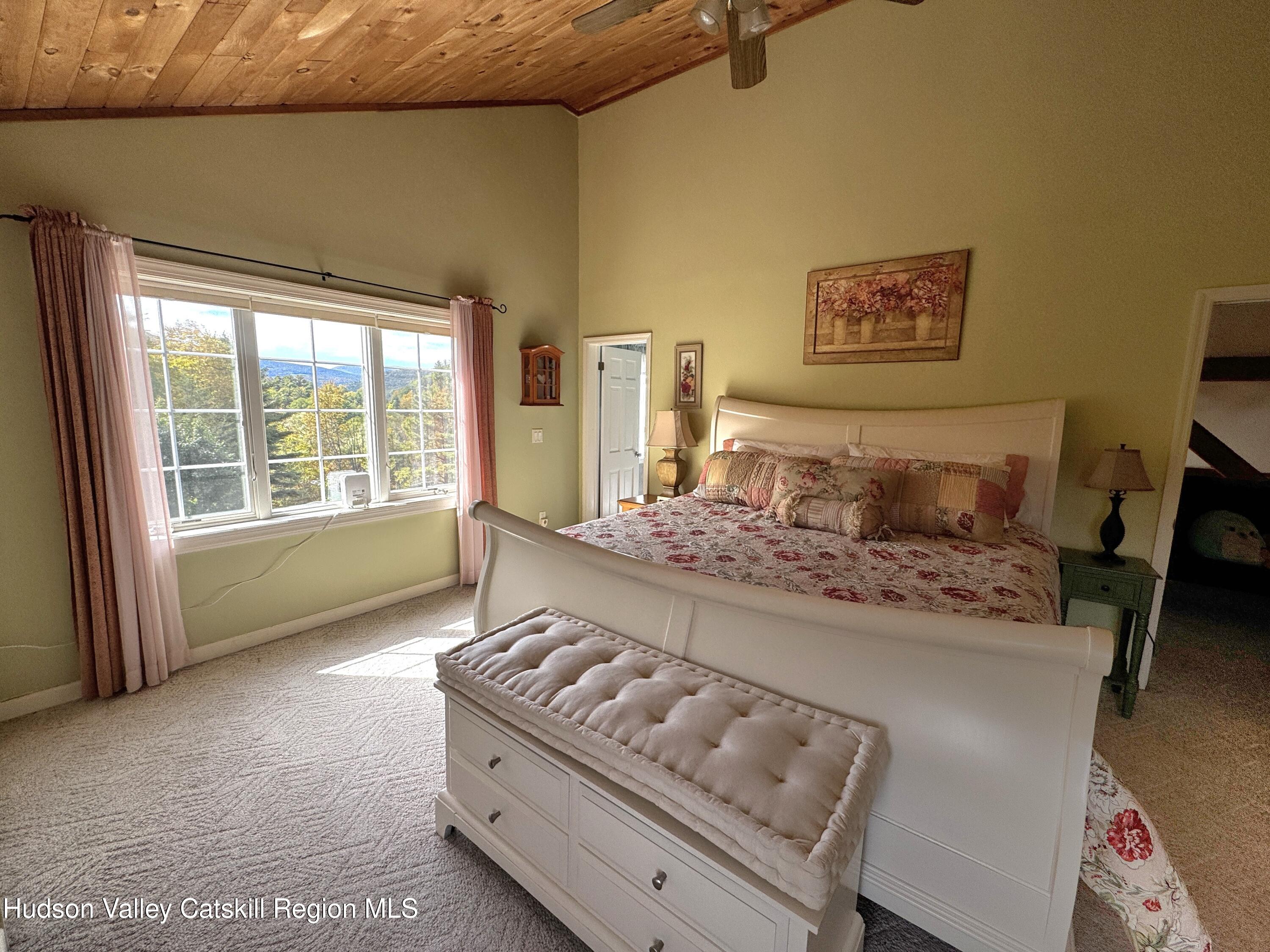 19 Pond View Road Ashland, NY 12468 - Photo 26 of 37 a bedroom with a bed and a window