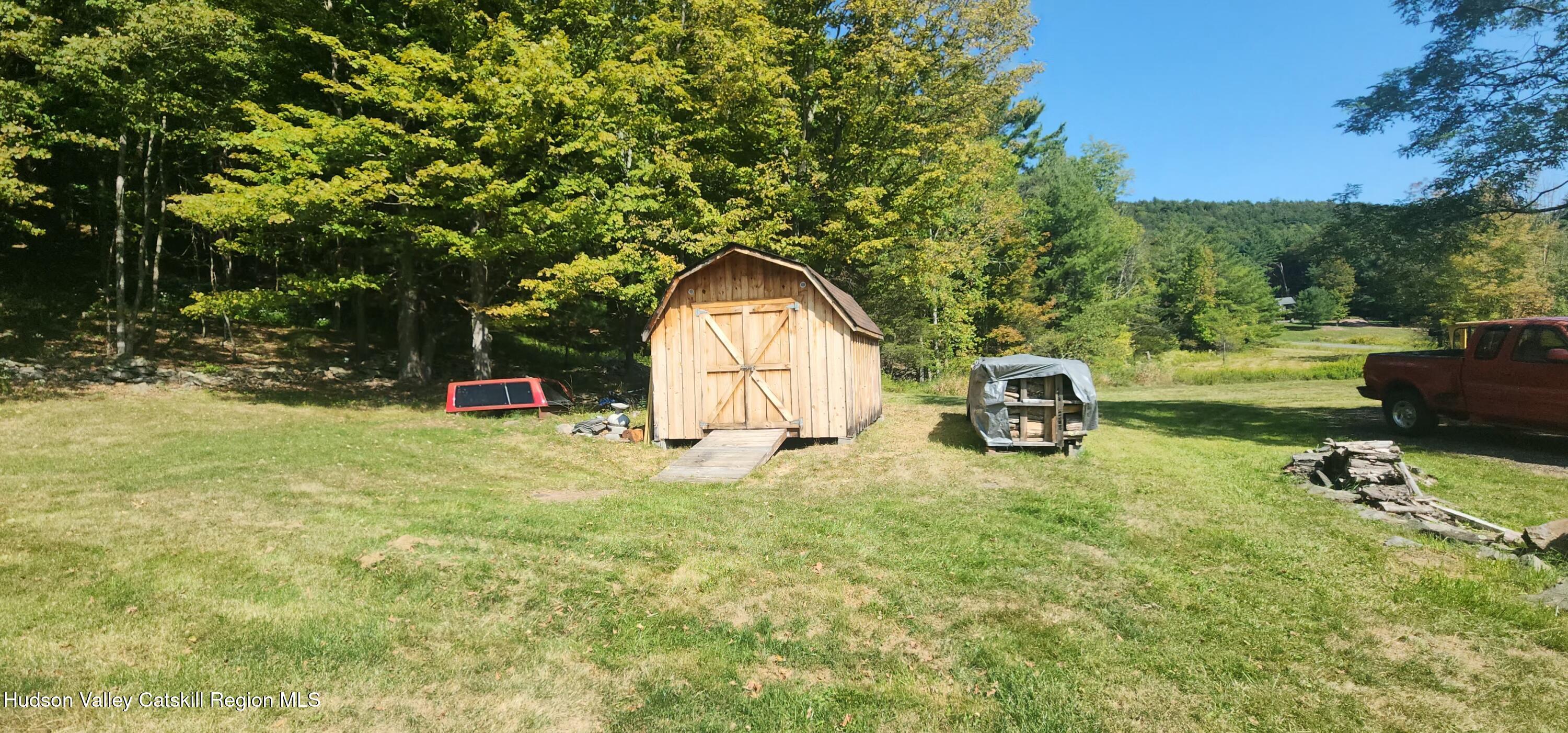 19 Pond View Road Ashland, NY 12468 - Photo 33 of 37 a view of a tiny house with a yard