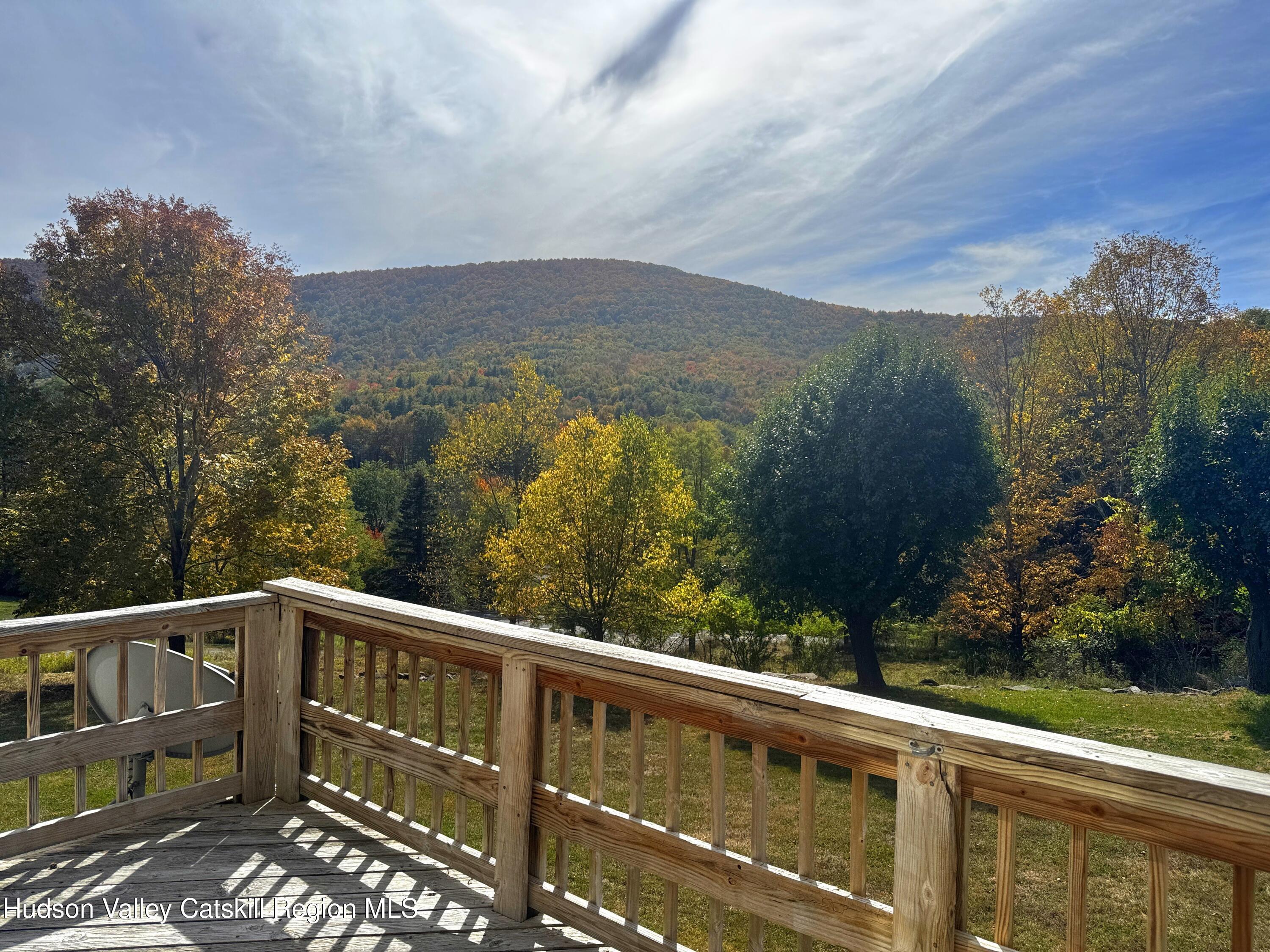 19 Pond View Road Ashland, NY 12468 - Photo 5 of 37 a view of a balcony with wooden floor and city view