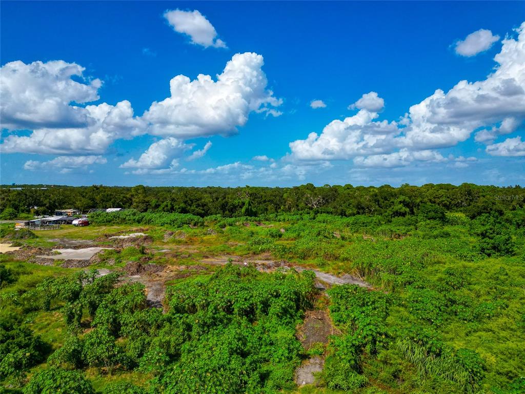 301 E Road Sarasota, FL 34240 - Photo 12 of 32 a view of a lake with lots of green space