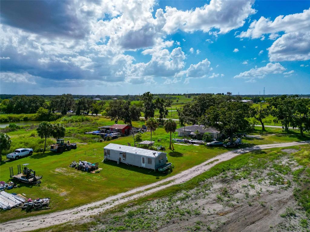 301 E Road Sarasota, FL 34240 - Photo 22 of 32 a view of a garden with houses