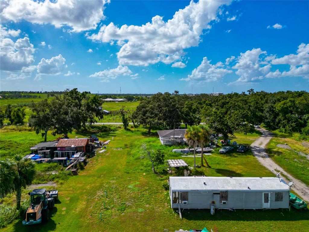 301 E Road Sarasota, FL 34240 - Photo 24 of 32 a view of yard with swimming pool and green space