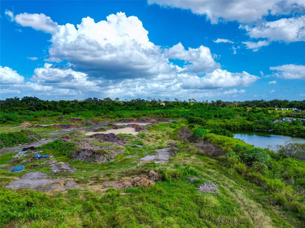 301 E Road Sarasota, FL 34240 - Photo 27 of 32 a view of a lake with a yard