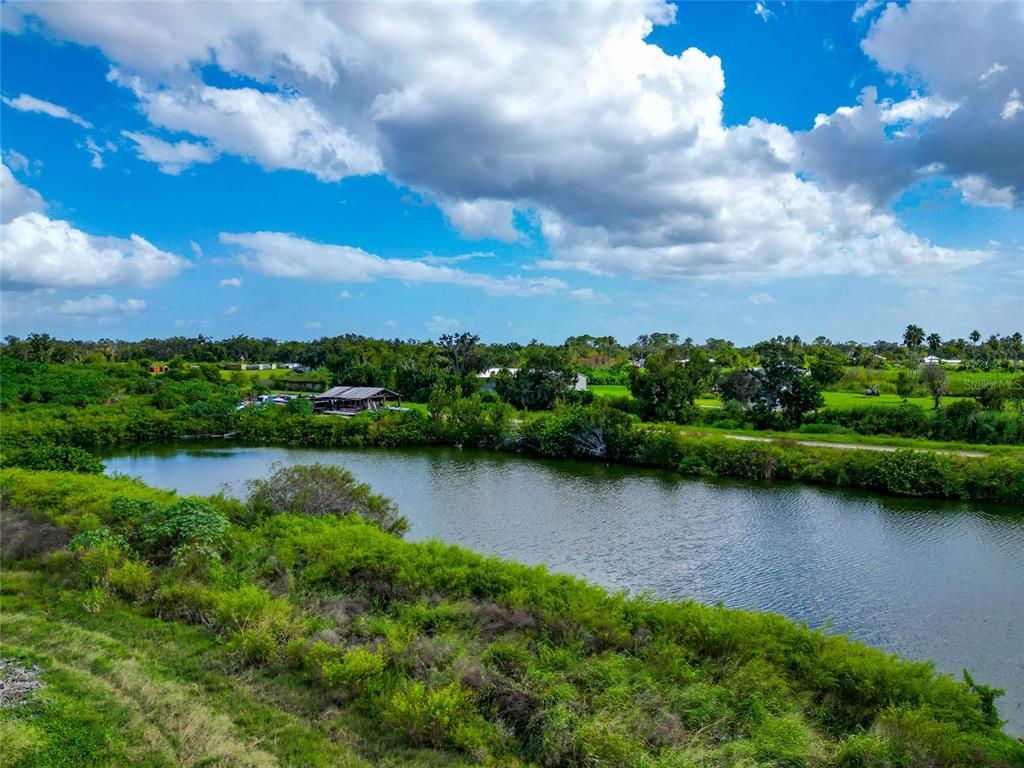 301 E Road Sarasota, FL 34240 - Photo 28 of 32 a view of a lake with a city