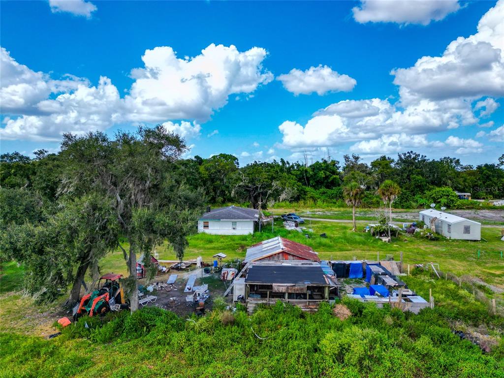 301 E Road Sarasota, FL 34240 - Photo 30 of 32 a view of a house with a big yard
