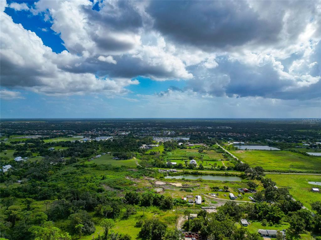 301 E Road Sarasota, FL 34240 - Photo 5 of 32 a view of a lake with houses in back