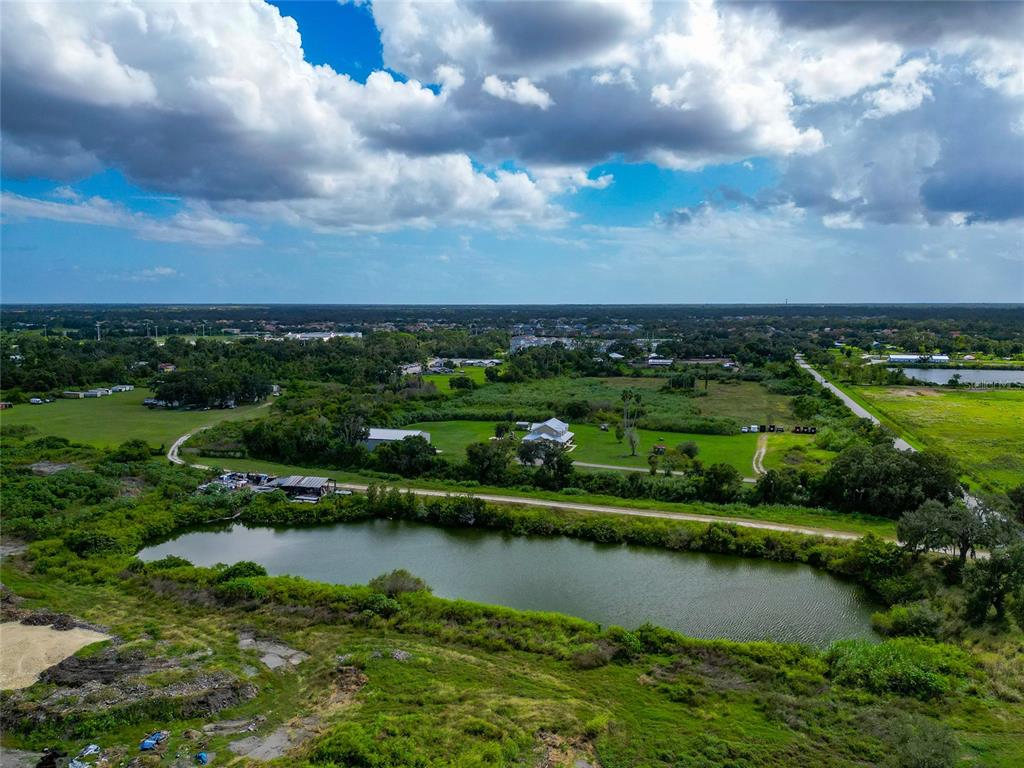 301 E Road Sarasota, FL 34240 - Photo 8 of 32 an aerial view of a city with houses