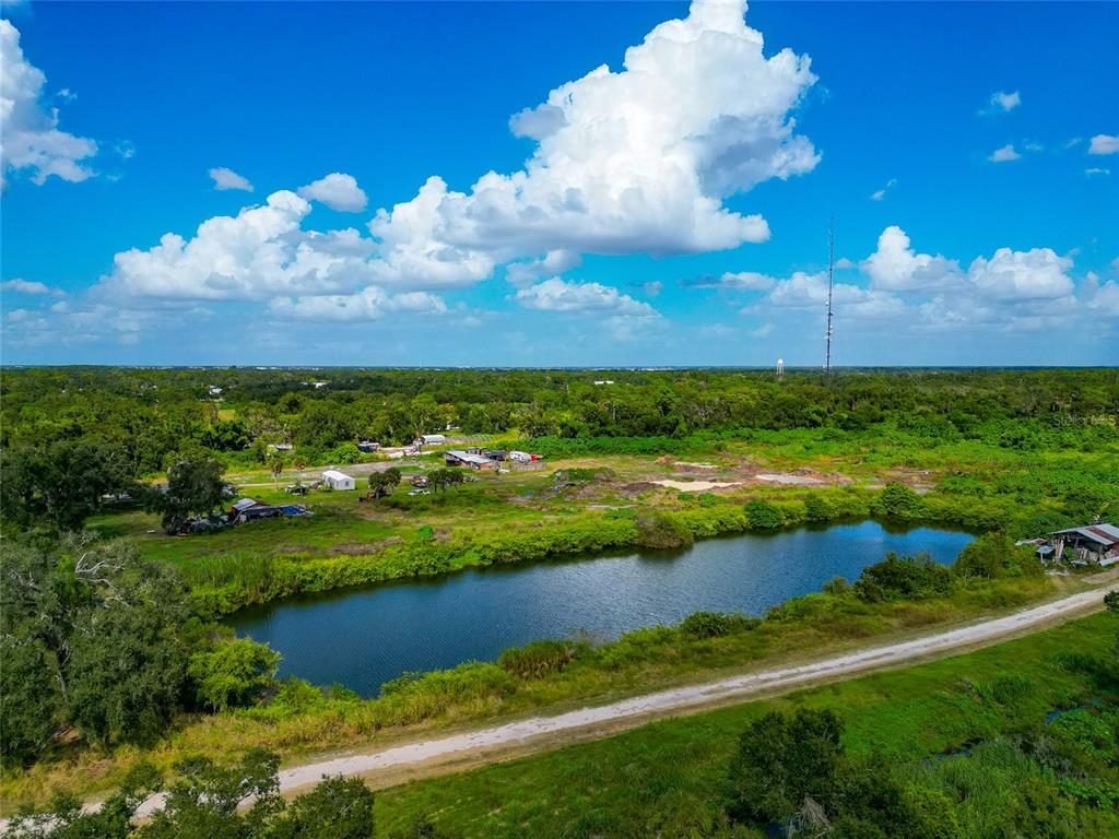 301 E Road Sarasota, FL 34240 - Photo 9 of 32 a view of a lake with houses in the background