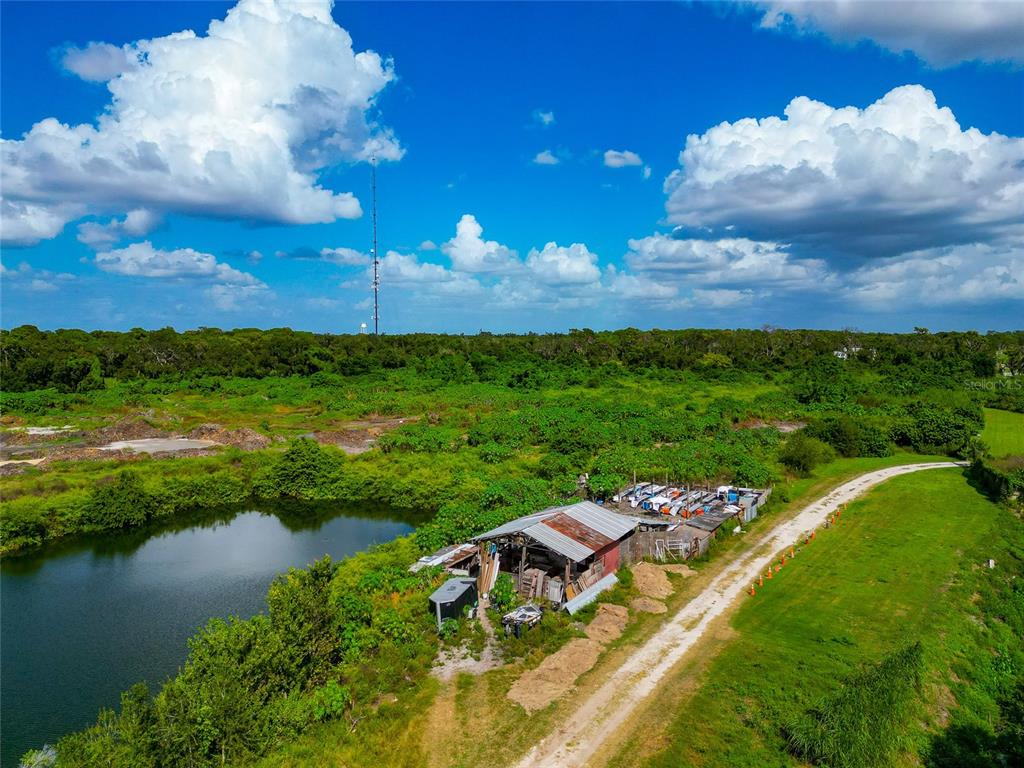 301 E Road Sarasota, FL 34240 - Photo 10 of 32 a view of a lake with a yard