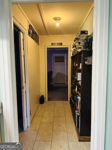 a bedroom with a bed a desk and chair